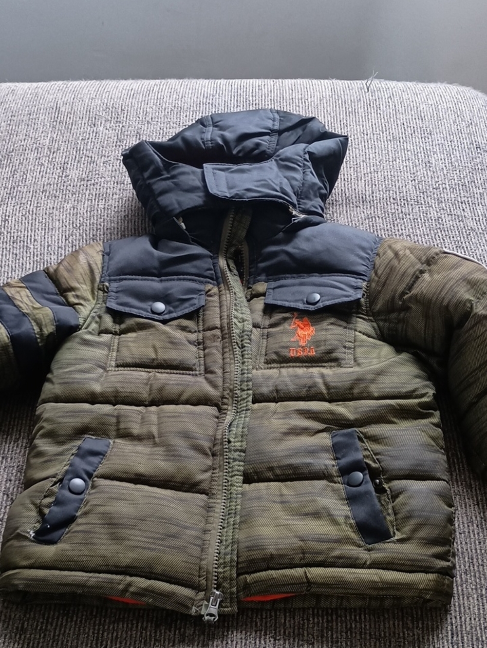 U.S. Polo Assn. Kids Olive Puffer Jacket with Black Hood and Orange Lining